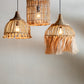 DeAbacaBirdCageHanglamp met twee andere gelijkaardige lampen met brandende lamp